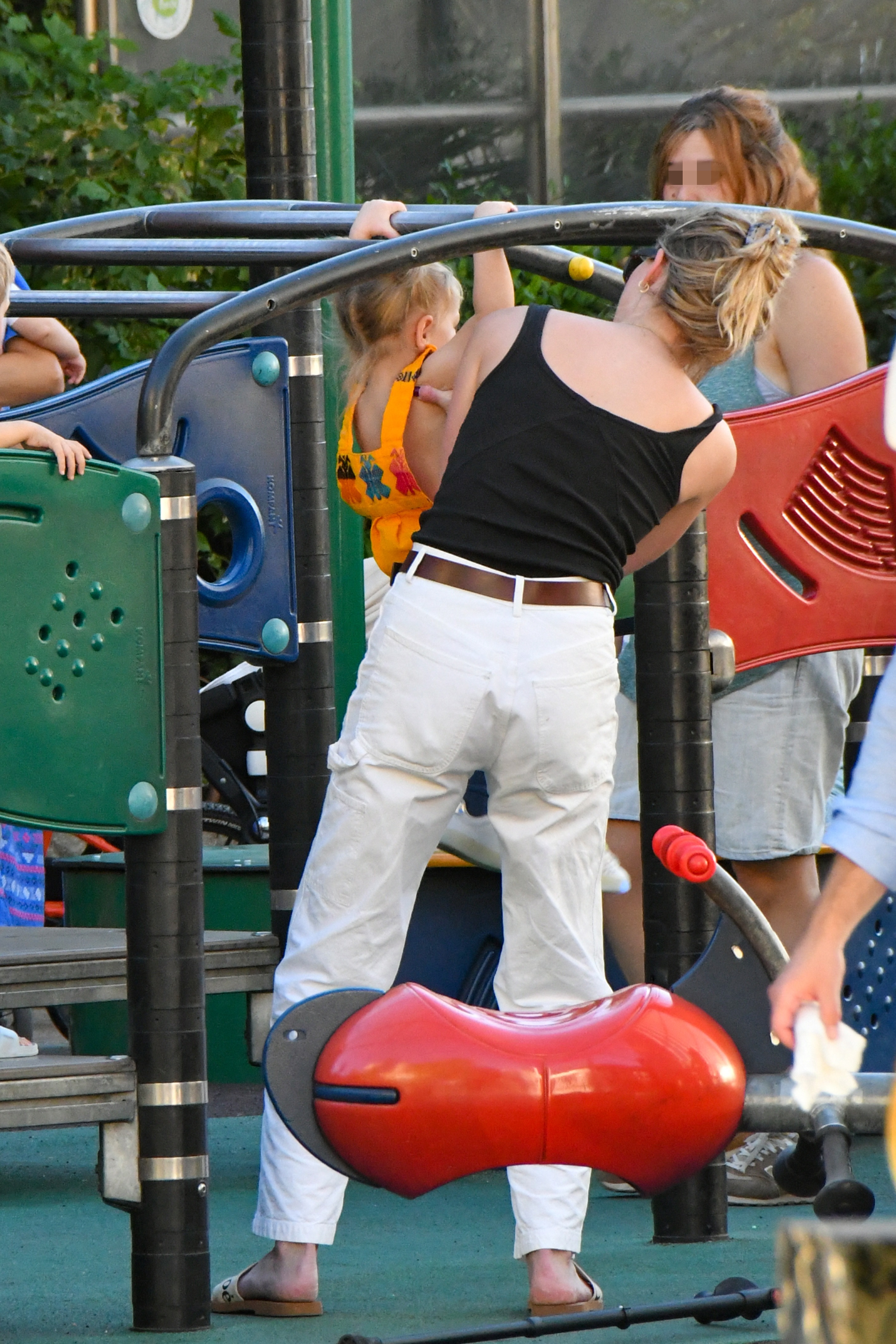 Amber Heard playing with her daughter at a playground