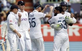 England players celebrating after Rehan Ahmed takes an India wicket courtesy of a Ben Foakes catch