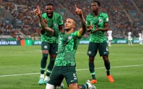 William Troost-Ekong (centre) celebrates scoring a penalty for Nigeria against South Africa at the 2023 Africa Cup of Nations