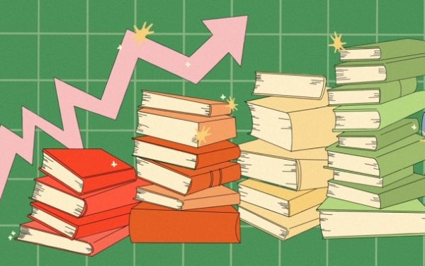 Stacks of books in red, orange, yellow, green and blue sit in front of a graph with an upwards pointing arrow